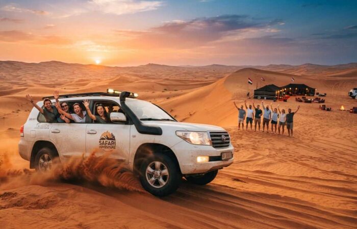 red dune dubai desert safari lahbab people waving at desert camp